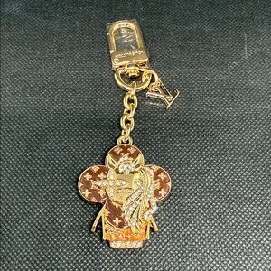 ✅ PRICE IS FIRM ✅ FASHION Gold and Brown Monogram Flower Bag Charm